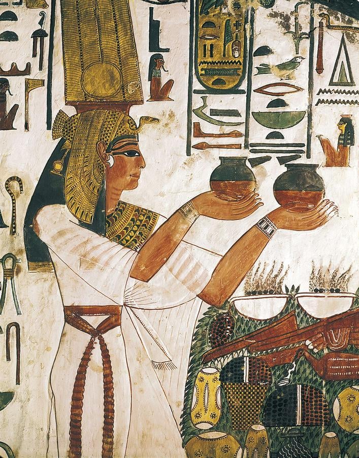 Nefertari, the first of the Great Royal Wives of Ramesses II, making an offering of two Nu vases.